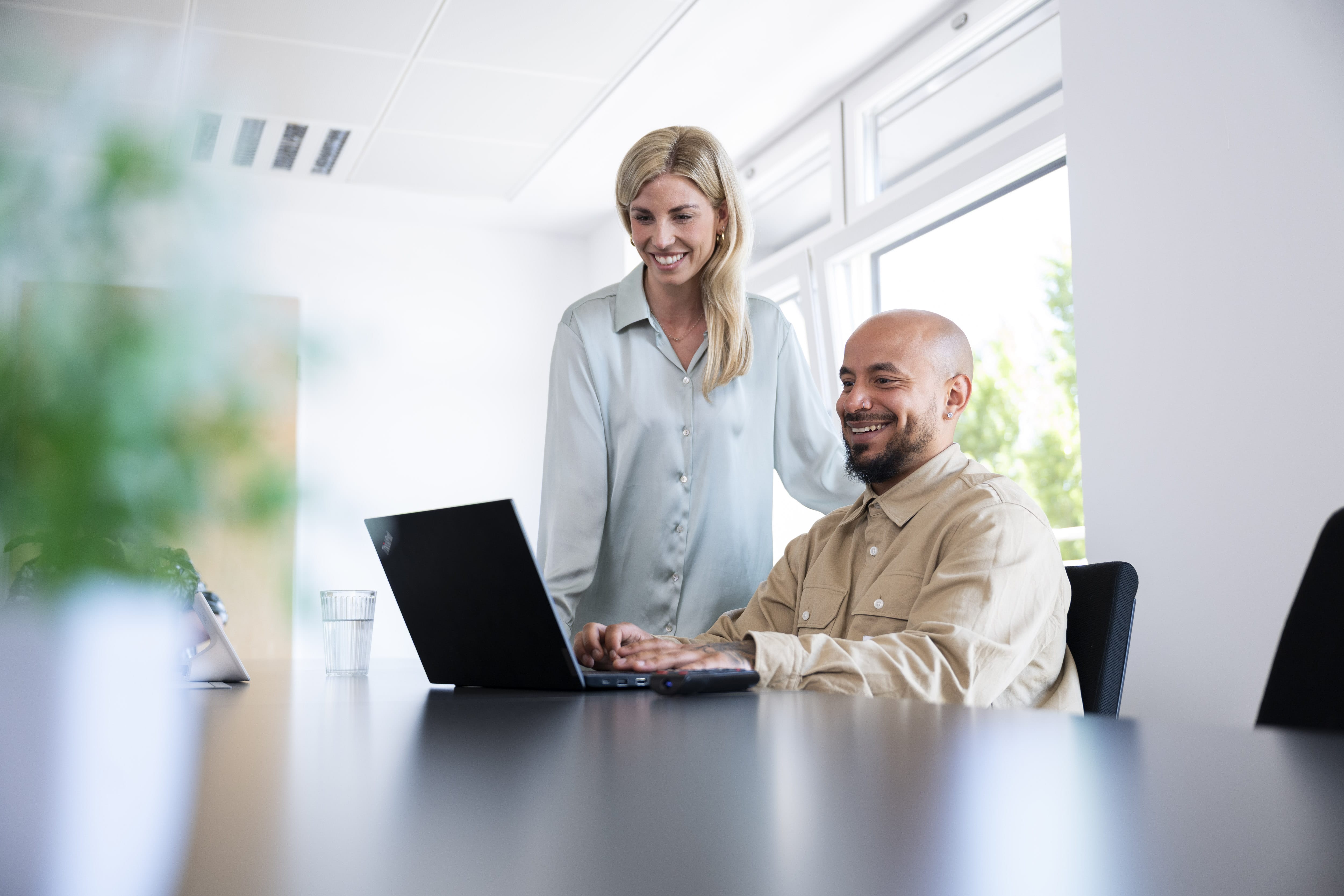 Two team members in the conference room